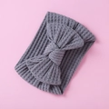 Detail of grey knitted waffle fabric baby headband with a large decorative bow - Grey Bow (14)