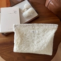 Elegant off-white floral lace makeup bag with matching hair accessories on wooden table - Cotton Floral Crochet / Cotton Thread Flower Embroidery