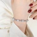 Silver beaded bracelet with polished spheres and crystal-studded charms on wrist - Rhinestone Ball Bead Style (E405) / Silver