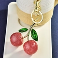 Sparkling red glitter cherry keychain with green leaves and gold metal link - Pink Cherry