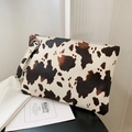 Chic cow print envelope clutch bag with leather texture and wrist strap detail - Cow Pattern Brown