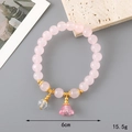 Pink glazed beaded bracelet featuring a delicate lily of the valley charm and gold accents - Light Pink Glaze Bead + Lily of the Valley (K3332)