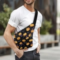 Halloween sling bag featuring pumpkin and bat patterns worn by model in outdoor setting - Halloween Sling 5-Black Bat Pumpkin