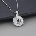 Silver-toned round letter Q necklace with sunburst cubic zirconia pavé and box chain - Letter Q / Silver