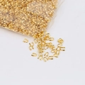 Golden U-shape wire protectors for jewelry making stored in transparent bags - Gold
