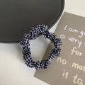 Simple Korean style hair scrunchie with black and white checkered pattern on a white desk - Black Grid
