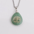 Detail of green teardrop stone pendant with golden Tree of Life on twisted silver chain - Green Waterdrop Pendant (NSN00137)