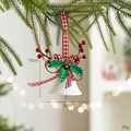Christmas bell ornament with red houndstooth bow and green holly on a tree branch - Open Bell / White