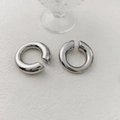 Macro shot of silver thick geometric hoop earrings with polished stainless steel finish - Minimalist Hoop Ear Clip (R514-138) / Silver
