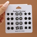 Minimalist 12-pair set of black geometric and flower earrings with crystals on display card - 12 Pairs Set - Black Geometric Floral