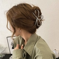Elegant silver metal bow hair claw clip for bun styling on high-quality model shot - Silver