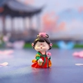 Cute tumbler figurine in red and green Hanfu holding a flower basket for desk decor - Walking Among Flowers Small / Ancient Style Ornament Series