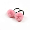 Pair of pink pom-pom hair ties for girls featuring elastic bands and soft plush texture - Pink