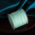Light blue 0.8mm polyester jade cord for DIY jewelry making on a white spool - Aqua Blue