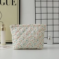 Macro detail of quilted cotton floral toiletry bag with zipper on a white desktop - 27*6.5*17.5cm / Red Green Blue Floral