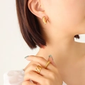Chunky gold-plated C-shaped earrings with zircon and pearl accents on model - Thick C-Shape / Gold Color Imitation Pearl Zircon