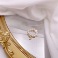Detail of freshwater pearl ring featuring a gold Z-letter pendant on vintage silk - Letter Z