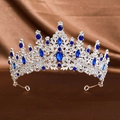 Close-up of bridal crown with blue gemstones and sparkling rhinestones on brown silk - Silver Royal Blue