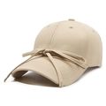 Beige cotton baseball cap with ribbon bow detail shown from a 45-degree side angle - Khaki