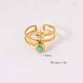 Macro detail of gold eight-pointed star ring with turquoise stone inlay, 15mm size - Amazonite