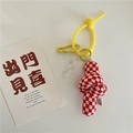Close-up of a yellow silicone spiral lanyard with a red and white checkered fabric knot - Red & White Checkerboard