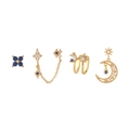 Dettaglio di un set di quattro orecchini dorati con zirconi blu scuro e bianchi brillanti - Set da 4 pezzi (Luna e stella) / Oro
