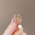 Elegant gold alloy clover brooch featuring hollow heart petals and a hanging pearl drop - 22# Clover
