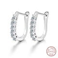 Detailed macro view of S925 sterling silver U-shaped earrings with sparkling cubic zirconia - Pave Row - 0.03ct Moissanite