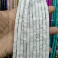 Macro shot of cylindrical white natural stone spacer beads for DIY jewelry making accessories - White Jade