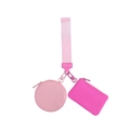 Macro shot of functional pink wristlet set with round coin pouch and rectangle wallet - Pink
