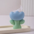 Blue and green tulip shaped scented candle with a white organza ribbon bow on a tray - Light Blue with Light Green Leaf