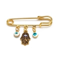Golden Hamsa Hand and Evil Eye charm brooch pin for women and men in a minimalist style - Pin with Blue Eye Hamsa and B&W Blue Eyes