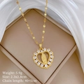 Macro detail of gold-plated religious heart pendant with micro-set zircons and chain - Virgin Mary Heart Relief Style (A405)