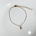 Detail of 18K gold plated bracelet with sparkling zircon letter R pendant and adjustable chain - Letter R