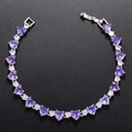 Silver bracelet featuring purple heart-shaped gemstones and white cubic zirconia - Platinum Plated Purple Zirconia