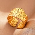 Macro shot of gold wide band ring with irregular hammered texture on silk background - Gold Wide Hammered (C1453)