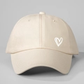Close-up of beige cotton baseball cap featuring a minimal white heart print on side - One Size / Beige