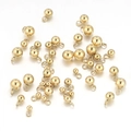 Macro shot of assorted golden stainless steel round ball pendants for jewelry making - Polished Smooth Style / 3mm / Gold