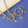 Golden clover and tree of life jewelry set featuring turquoise charms and woven chains - Necklace And Bracelet