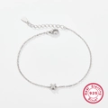 925 sterling silver bracelet featuring a dainty X-shaped pendant set with zircon stones - Letter X / White Gold