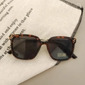 Detail of tortoise shell sunglasses with UV400 lenses and triple rivet accents - Leopard Print