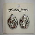 Minimalist irregular lava-style earrings in polished silver finish on display card - Oval Irregular / Steel