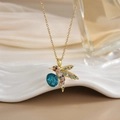 Detailed shot of hummingbird necklace with colorful zircon stones and blue gem pendant - FN0105 Multi-color Pave Dark Blue Stone Hummingbird