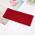 Detail of red ribbed knit yoga headband with high elasticity and soft cotton texture - Burgundy