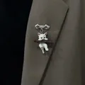 Cute white cat clinging to brown branch brooch pinned on a stylish brown blazer lapel - Brooch / Cat on Branch (Silver Pin)