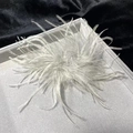 Elegant white ostrich feather brooch and hair clip on a premium grey jewelry tray - Light Gray