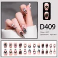 Macro detail of D409 pink french press-on nails with black gradient and heart motifs - 24 Pcs/Set / Nude Pink Black Ombre Heart Glitter Style (D409)
