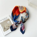 Artistic silk square scarf featuring sun face print and tropical leaves in orange and blue - 70cm / Blue Edge Moon Face