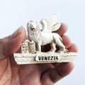 White resin winged lion of Venice souvenir magnet with Venezia engraving and scroll - Venice Winged Lion