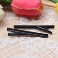 Set of two black 6cm metal duckbill hair clips with a glossy finish on lace backdrop - Black